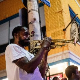 Jazz band with man playing a trumpet in New Orleans at Mardi Gras.
